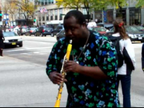 Street Corner Jazz.Street performer displaying his clarinet skills on Michigan Ave. Chicago, Illinois.